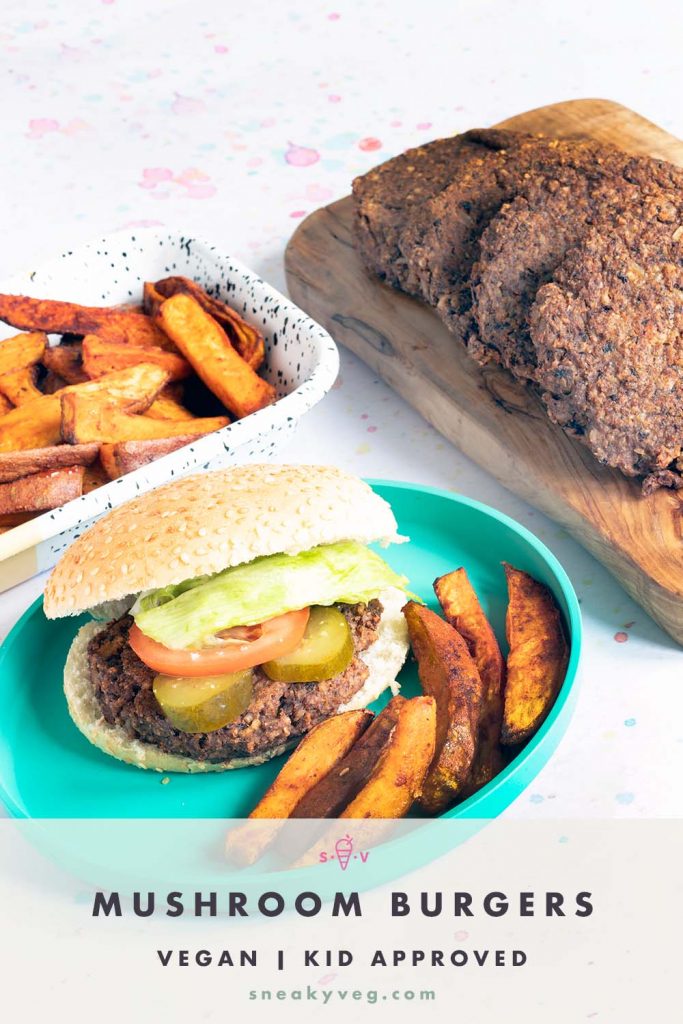 Mushroom burger with sweet potato wedges on blue plate