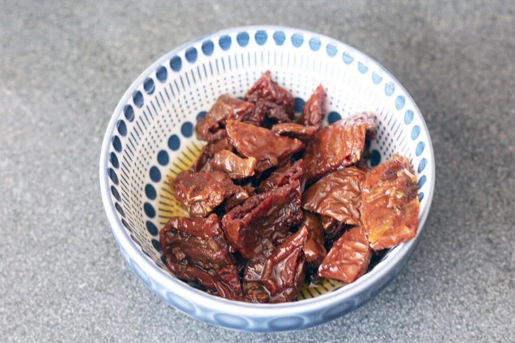 sundried tomatoes in blue and white bowl