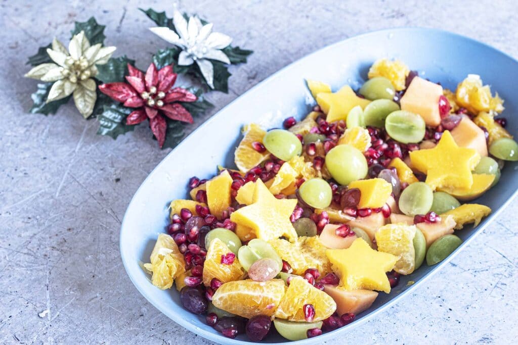 Christmas fruit salad in yellow bowl