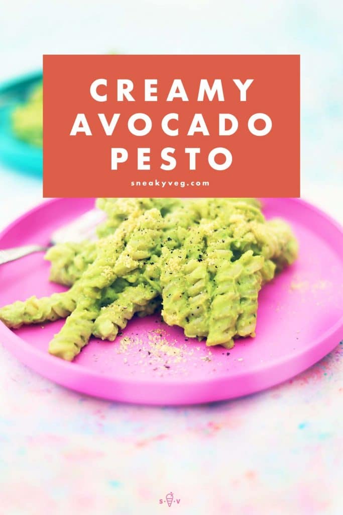 avocado pesto pasta on pink and blue plates