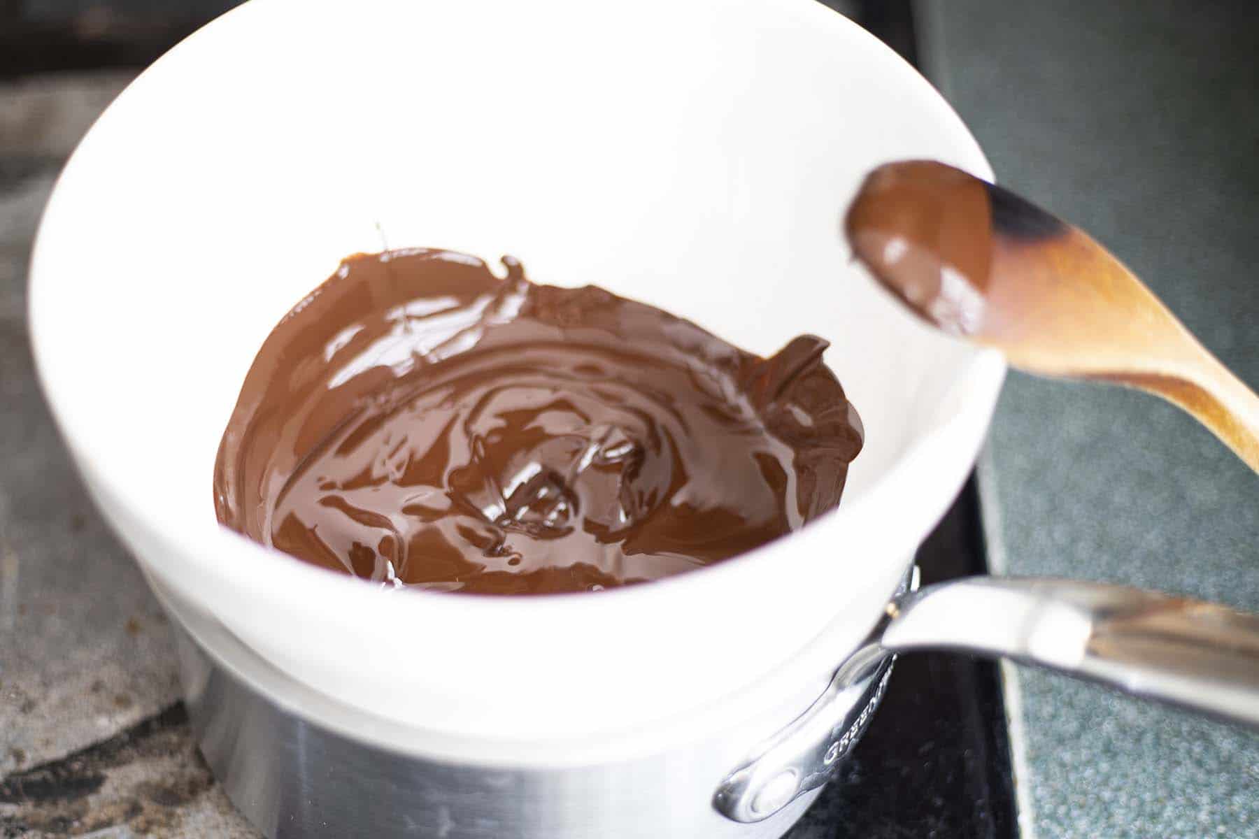 chocolate melting in cream bowl