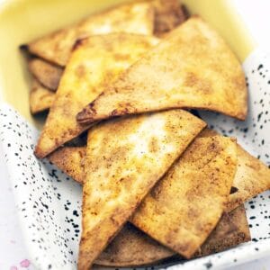 homemade tortilla chips in yellow and white baking dish