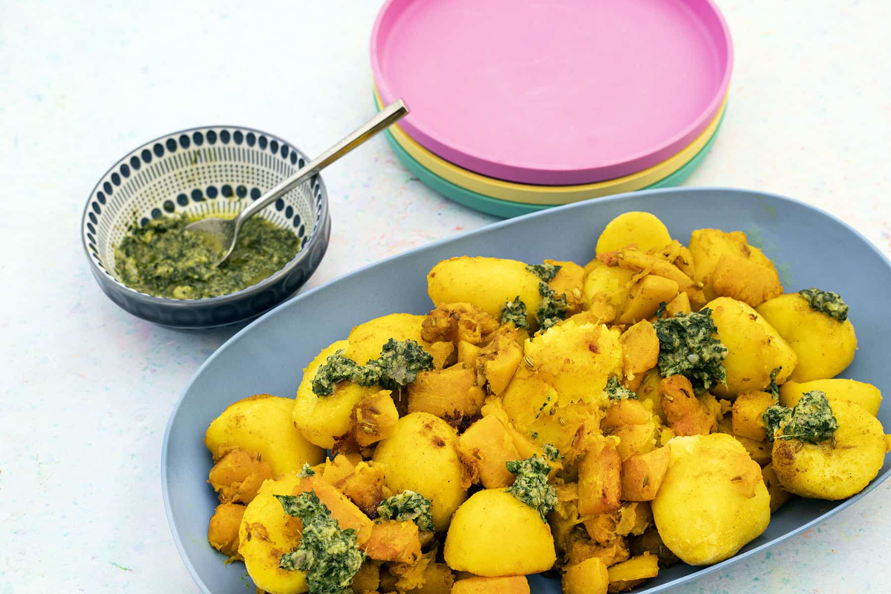 roast potatoes and squash with mint salsa in blue platter