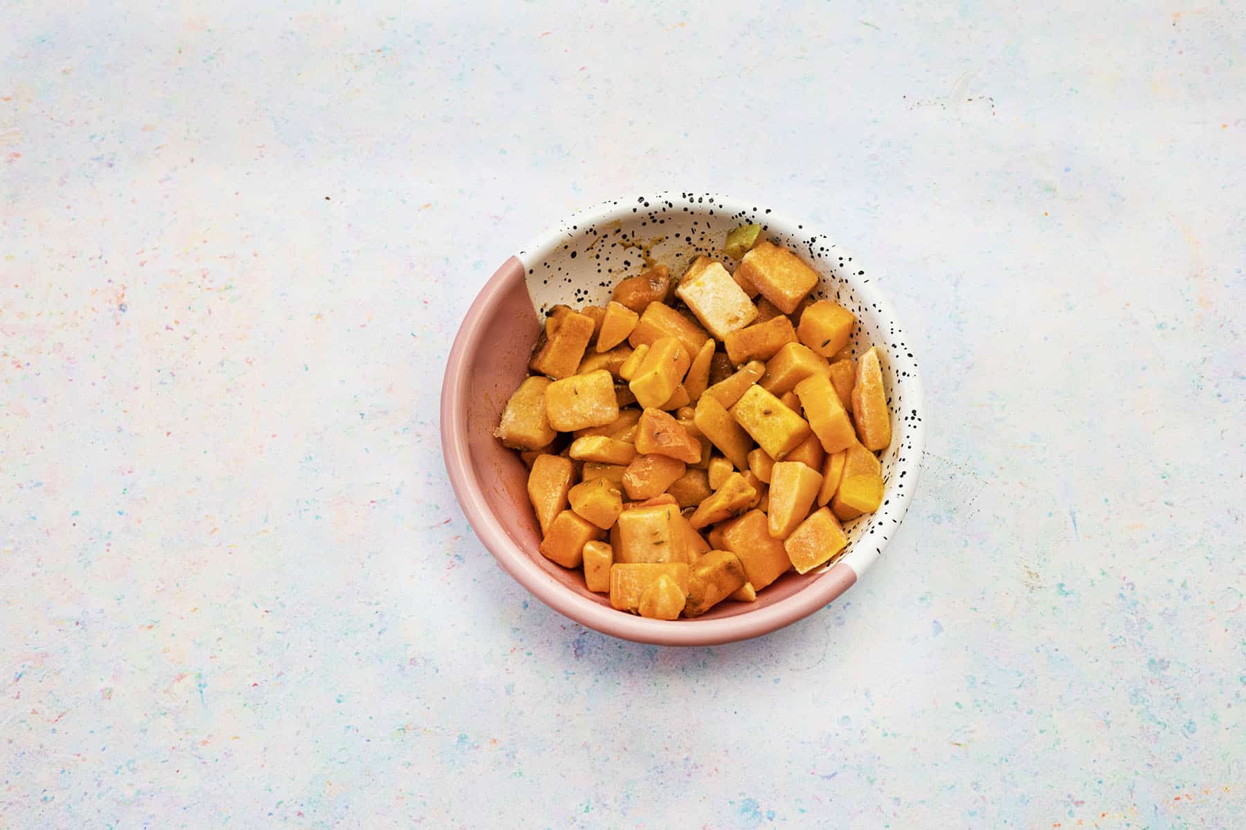 pink and white bowl of butternut squash