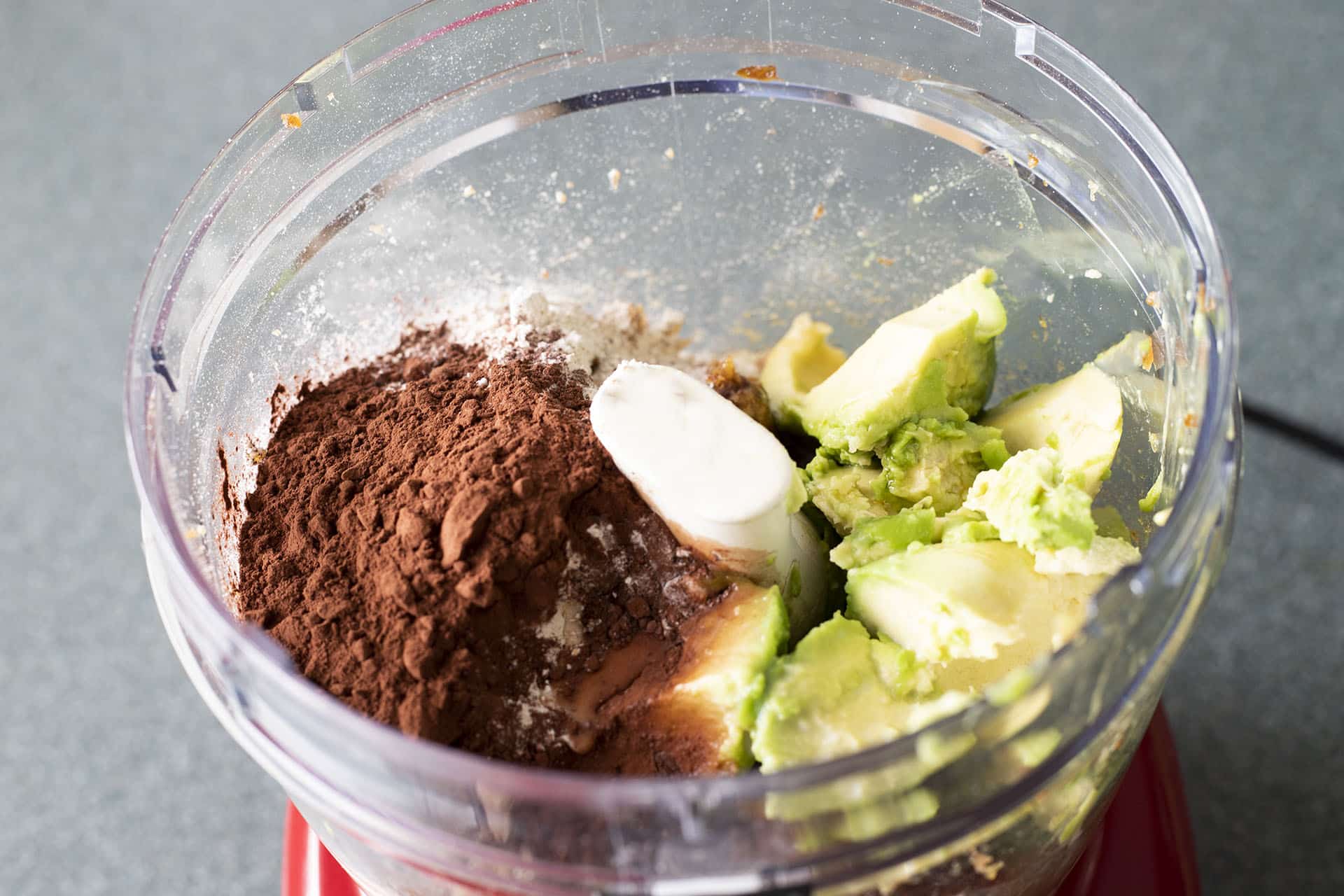 avocados and chocolate powder in food processor