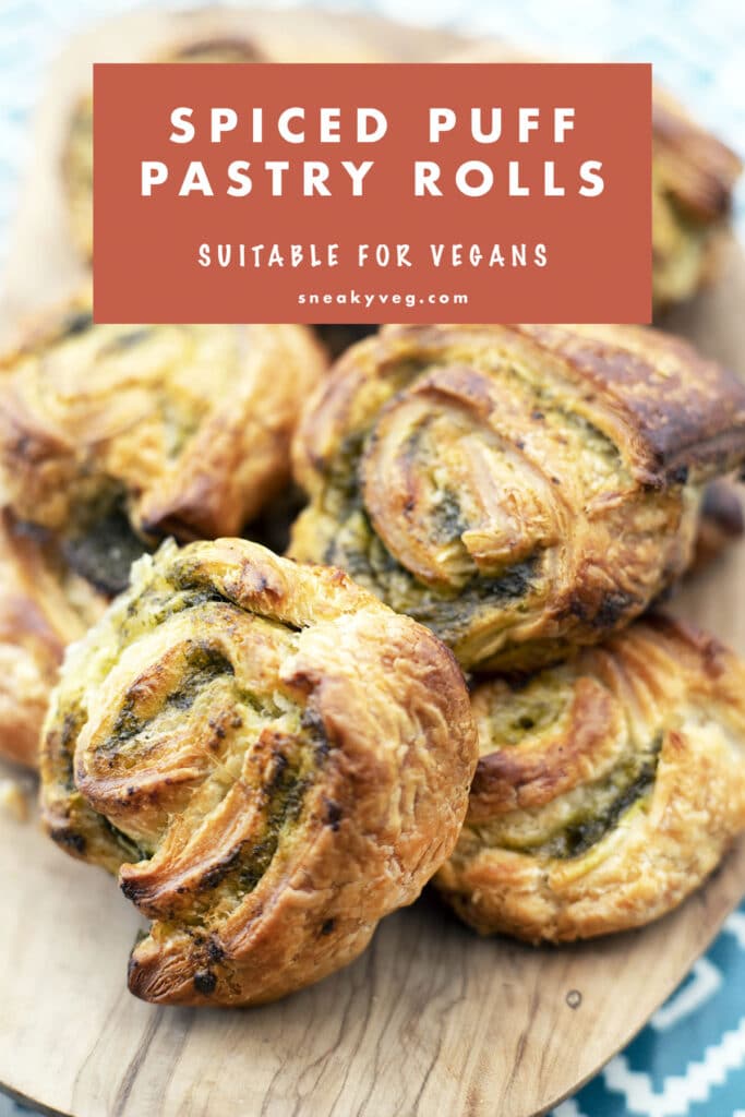 spiced savoury puff pastry rolls on a wooden platter